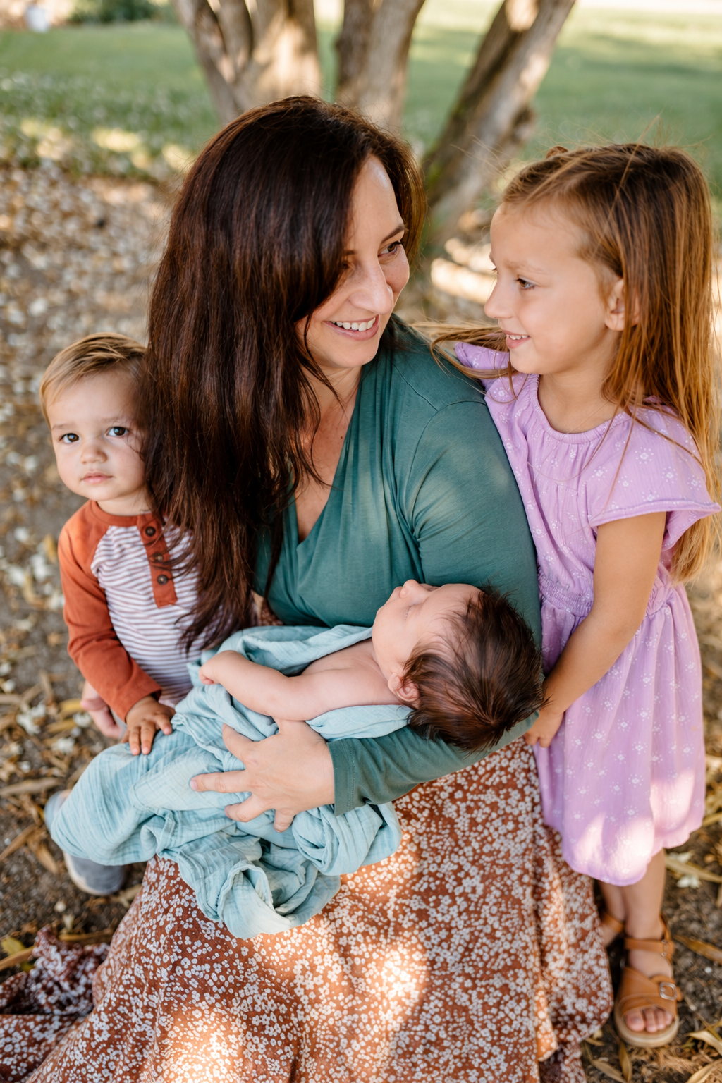 The founder of Davis Doulas with children and a newborn